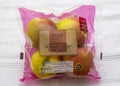 A four pack of Pink Lady eating apples with Marks and Spencer labelling and price tag