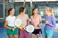 Four padel players standing in court and having conversation Royalty Free Stock Photo