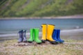 Four pair of rubber boots on the beach, Ersfjord beach, Senja Royalty Free Stock Photo