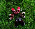 four pair of shoes representing family, growth, education and togetherness concept Royalty Free Stock Photo