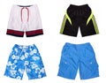 Four pairs of colored shorts isolated on white background, collage of shorts