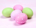 Four pastel colored easter eggs on white background pink green Royalty Free Stock Photo