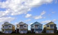 Four pastel houses