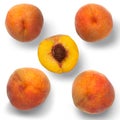 Four peaches and a half on a white background Royalty Free Stock Photo