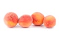 Four peaches on a white background isolated close up Royalty Free Stock Photo