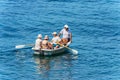 Four People aboard a Small Rowing Boat - Mediterranean Sea Liguria Italy