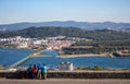 Four people back view on Viana de Castelo landmark, Portugal. Tourists on aerial panoramic landscape background.