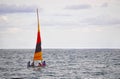 Four people sailing in a small boat