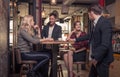 Four people talking, small group of people talking, coffee shop Royalty Free Stock Photo