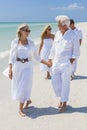 Four People Two Senior Family Couple Walking Tropical Beach Royalty Free Stock Photo