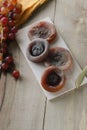 Persimmons on wooden tray