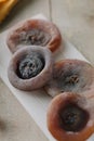 Persimmons on wooden tray