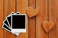 Four photo on hearts wooden background