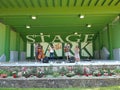 The four-piece band plaing at park bandshell