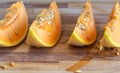 Four Pieces Of Fresh Juicy Melon Wooden Table 1 Royalty Free Stock Photo