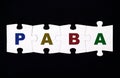 Four pieces of puzzle with letters PABA