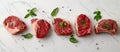 Four Pieces of Raw Meat on White Counter Royalty Free Stock Photo