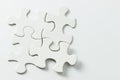 Four pieces of white jigsaw puzzle