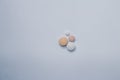Four pills on a white background Free space to write. Concept of self-medication Royalty Free Stock Photo