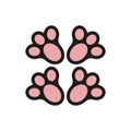 The four pink paws of the animal as seen from below. Pink paw prints.