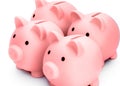 Four pink piggy banks isolated against white background