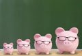 Four pink pigs with glasses