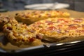 Four pizzas on a baking sheet Royalty Free Stock Photo