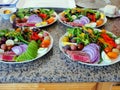 Four plates of Home made Nicoise salad ready to serve Royalty Free Stock Photo