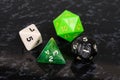 Four platonic dice. Royalty Free Stock Photo