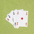 Four playing cards depicting aces