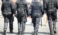 four policemen of special force unit patroling the city Royalty Free Stock Photo