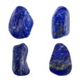 Four polished lapis lazuli stones isolated on white background Royalty Free Stock Photo