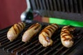 Four pork sausages white grilled delicious and quick snack for beer Royalty Free Stock Photo