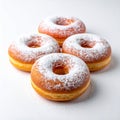 Four Powdered Sugar Donuts on White Background in Studio Lighting Royalty Free Stock Photo