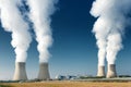 Four power plant cooling towers steaming Royalty Free Stock Photo