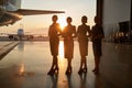 Attractive ladies posing together in the airport hangar