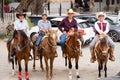 Four proud Mexican Charros posing on horses with a smile Royalty Free Stock Photo