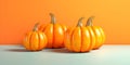 Four pumpkins on bright background. Autumn harvest, fall still life, minimalism