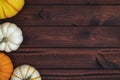 Four pumpkins on a brown background.