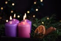 Four purple advent candles in Christmas eve