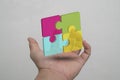 Four puzzle pieces make up a square for a business choice idea Royalty Free Stock Photo