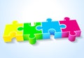 Four puzzle yellow green blue red lie on a white Royalty Free Stock Photo