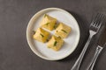 Four pyramid shaped herb cheese bites served with chives Royalty Free Stock Photo