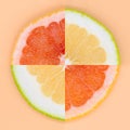 Four quarters of grapefruit and sweety on various colored backgrounds arranged Royalty Free Stock Photo