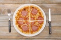 Four quarters - Pizza pieces series as illustration of division in maths on wood table Royalty Free Stock Photo