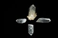 Four quartz crystals on black background forming cross Royalty Free Stock Photo