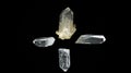 Four quartz crystals on black background forming a cross Royalty Free Stock Photo