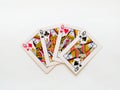 Four queens from a deck of playing cards isolated on a white background. Pik, club, diamond and heart suit