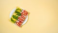 Four rectangular sandwiches with cheese and ham whole grain crisps on a white plate Royalty Free Stock Photo