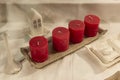 Four red advent candles on table with christmas decoration on background, the christmas period, adventsljusstake Royalty Free Stock Photo